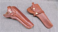 x2 leather holsters. old west 43. unmarked.