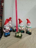 Group of garden gnomes and frog statue