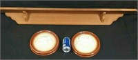 Two ceramic wall plaques and wooden shelf  54"