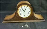 Mantel clock with key,  front glass is missing