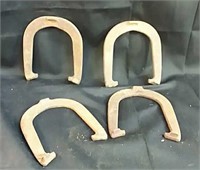 Set of four metal horseshoes
