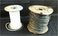 Two partial rolls of electrical wire