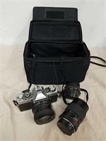 Vintage Minolta XG 1 camera with lenses and