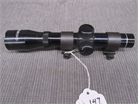 Tasco 2x20 pistol scope and weaver rings.