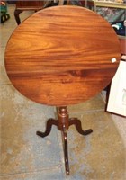 Round Mahg. tilt top Table w/ carved pedestal
