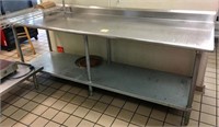 APPX. 8' LONG STAINLESS STEEL FOOD PREP TABLE.