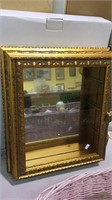 Square Curio cabinet in gold leaf finish with