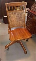 Oak office chair on casters with woven back
