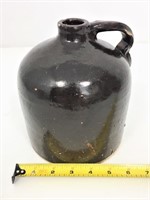 Brown stoneware jug.