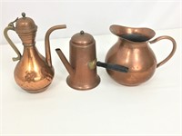Copper toned pitchers.