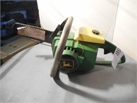 Green and yellow John Deere Chain Saw toy