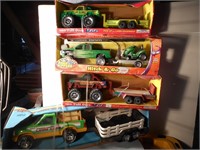 Four Plastic truck and trailer sets