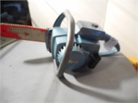 Light blue Homelite toy chain saw