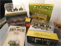 Group of small scale John Deere tractors