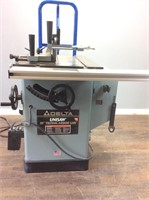DELTA 10’’ UNISAW TABLE SAW W CAST IRON TABLE
