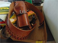 Leather pistol holster, rifle cover, ice cleats