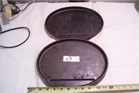 Pair of large cast iron griddles