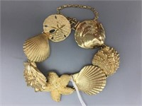 14 karat gold linked seashell bracelet;