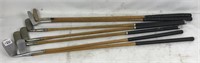 Seven vintage wood shaft golf clubs