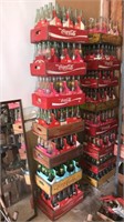 Seven Coca-Cola crates full of soda bottles Most