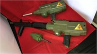 Two battery operated toy monkey guns,  One has
