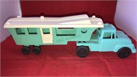 Molded plastic turquoise truck and travel