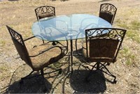 metal base glass top table,4 chairs good condition