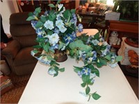 2 blue floral arrangements - 1 in copper like