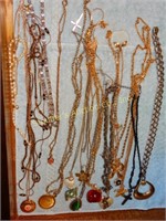 Necklace lot - crosses, apple, coin, sea shell,