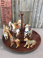 Carousel animals on turntable display, partial set