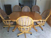 Oak Designer Table and 6 Swivel Arm Chairs