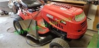 Huskee red riding mower with a blower