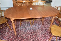 1965 model dining room table with turned legs on