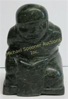 ISAH - INUIT GREEN STONE CARVING OF A KNEELING MAN
