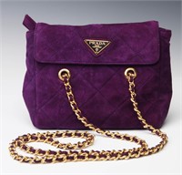 A PRADA QUILTED CLUTCH WITH WOVEN CHAIN STRAP