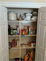 Kitchen Appliances And Food Items In Pantry