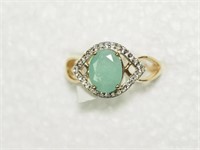 SILVER EMERALD AND CUBIC ZIRCONIA RING.