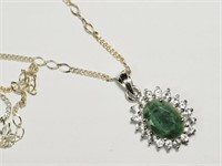 SILVER LARGE EMERALD AND SIDE TOPAZ NECKLACE.