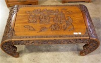 Carved teak coffee table