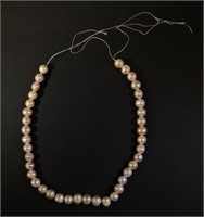 STRING OF CULTURED PEARLS - LIGHT PINK IN COLOR