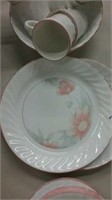 Partial set of pink and white china