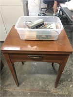 Singer sewing machine cabinet with accessories