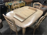 Dining table, leaf, and four chairs 

Shows