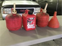 3 small plastic gas cans and plastic funnel