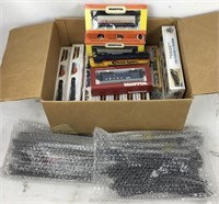 Box of Model Train Cars and Track