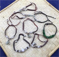 8 Strung Bracelets With Beads and Carvings
