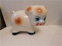 Vintage piggy bank, cream with brown spots, has