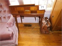 Singer sewing machine in cabinet, 24" x 17" -