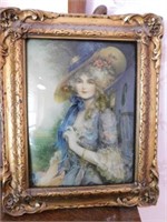 Picture of Gibson Girl in ornate frame, slightly