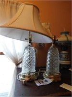 Pair of clear glass dresser lamps with brass